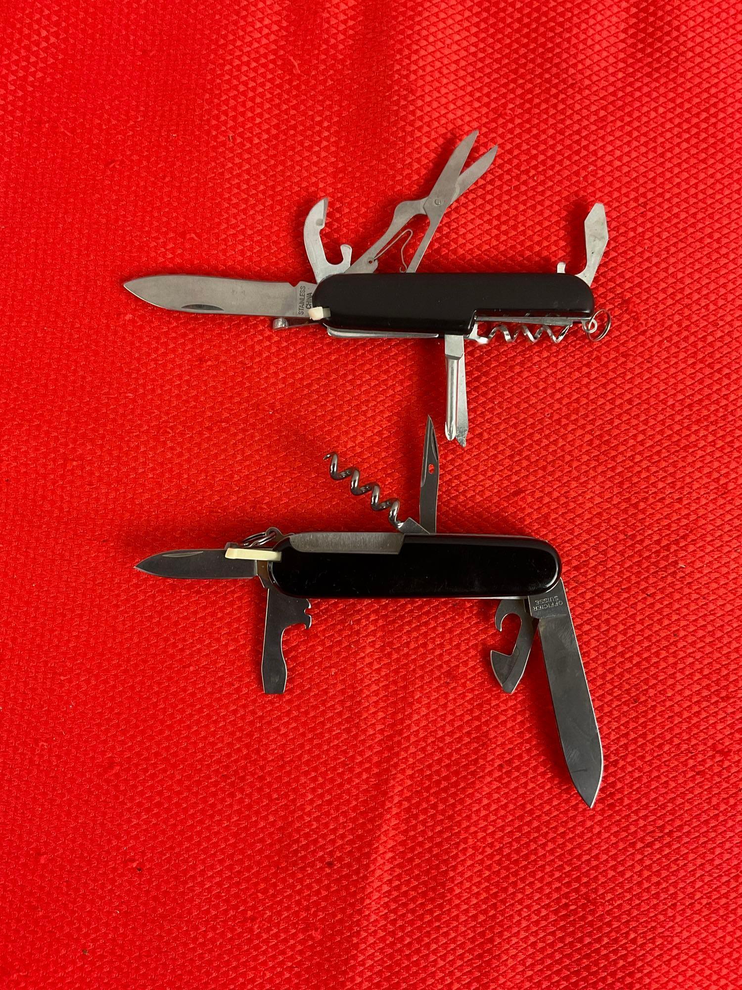 2 pcs Steel Folding Multi-Tool Swiss Army Pocket Knives. 1 Victorinox Officer Suisse, 1 Unmarked.