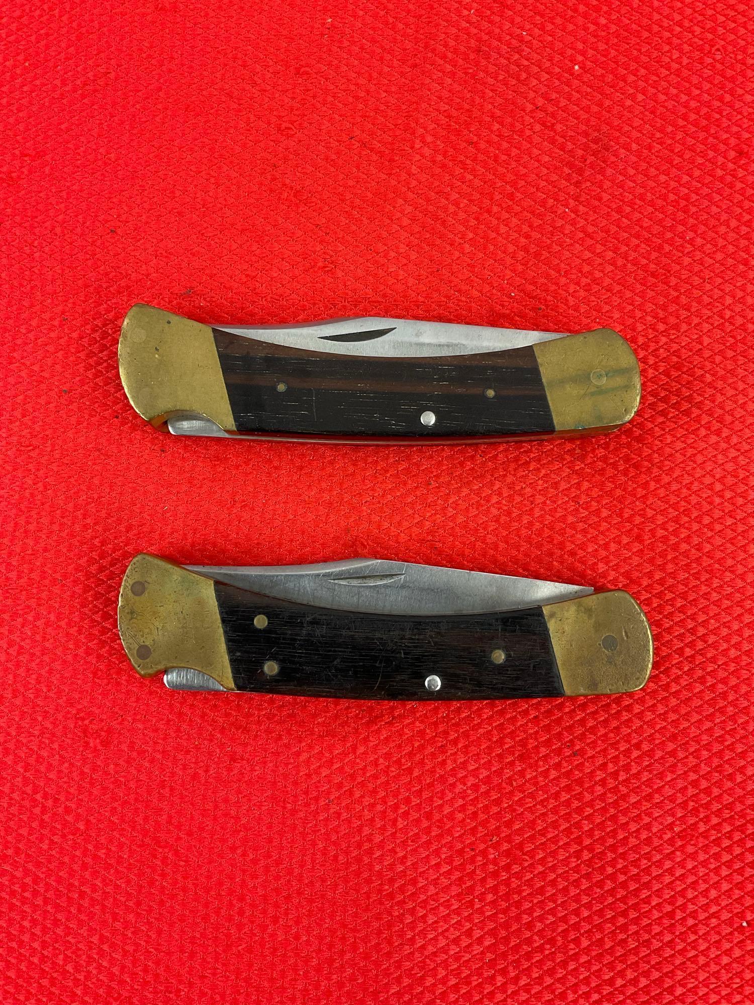 Pair of Vintage Buck 3.75" Steel Folding Blade Pocket Knives Model 110 w/ Ebony Handles. See pics.