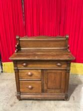 Antique Wheeled Wooden Commode w/ 3 Drawers, 1 Cupboard & Handsome Carved Details. See pics.