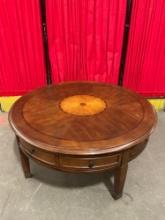 Modern Round Cherry Finish Wooden Wheeled Coffee Table w/ 4 Drawers & Sunburst Inlay. See pics.