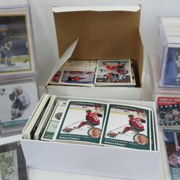 Collectible hockey cards and hockey pucks.