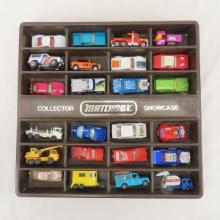 24 vintage Matchbox cars in collector showcase