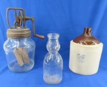 Glass butter churn, stoneware jug, milk bottle