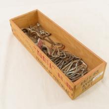 Collection of vintage bottle openers in wood box