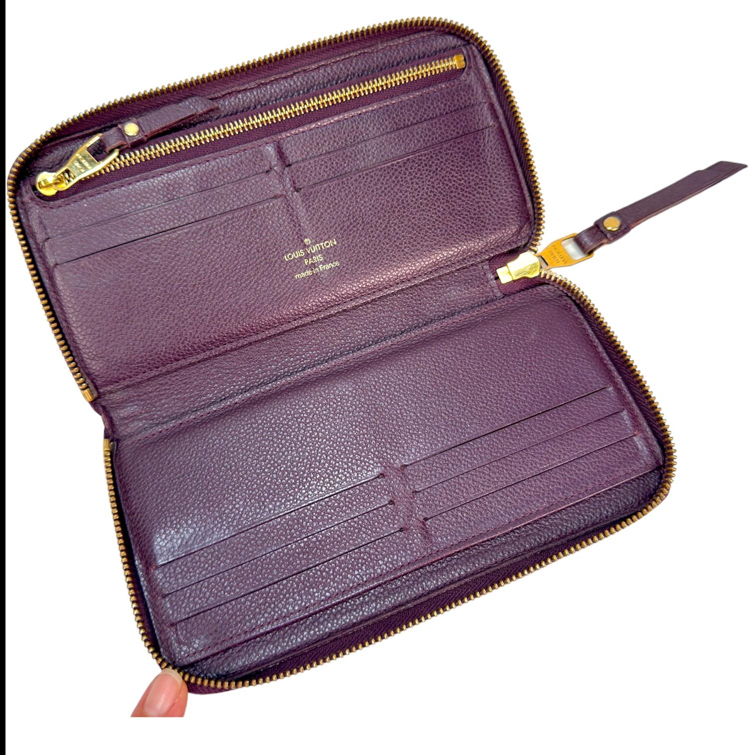 Authentic estate Louis Vuitton Empriente Zippy purple leather wallet