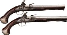 Pair of Silver Mounted Flintlock Pistols by Henry Delany
