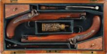 Cased Pair of Engraved Back Action Percussion Pistols by Simmons