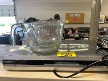 DVD Player & Pyrex Measuring Cups