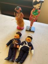 Vintage dolls. Officer, mailman, Hawaian & Oriehral dolls with stands. 4 dolls