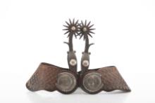 Pair of single mounted Spurs marked inside bands "Garcia". Spurs have raised engraved domed conchos