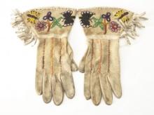 Pair of Doe Skin beaded Wild West Gauntlets with fringed border, circa 1910-1920. Showing use but in