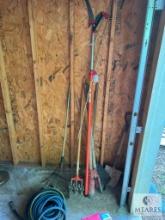 Group of Lawn Tools and Water Hose