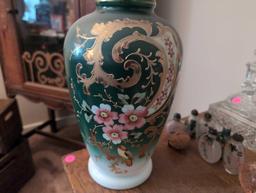 (LR) VINTAGE PAINTED MILK GLASS ORIENTAL DETAILED FLOWER VASE. FEATURING A MAIN GREEN COLOR WITH