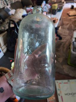 (LR) ANTIQUE BUFFALO GLASS WATER BOTTLE. READS "MINERAL SPRINGS NATURE MATERIA MEDICA WATER".