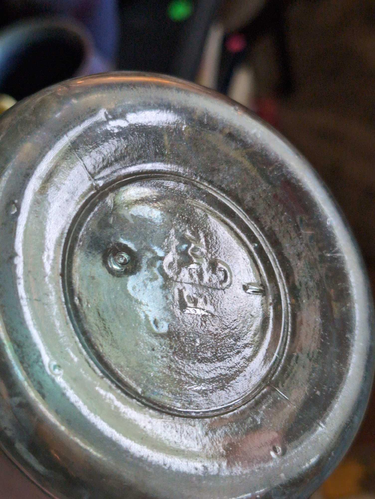 (LR) ANTIQUE BUFFALO GLASS WATER BOTTLE. READS "MINERAL SPRINGS NATURE MATERIA MEDICA WATER".
