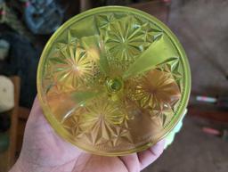 (LR) VINTAGE YELLOW VASELINE GLASS FOOTED CAKE PLATE. 9"T X 6-1/4" DIAMETER.