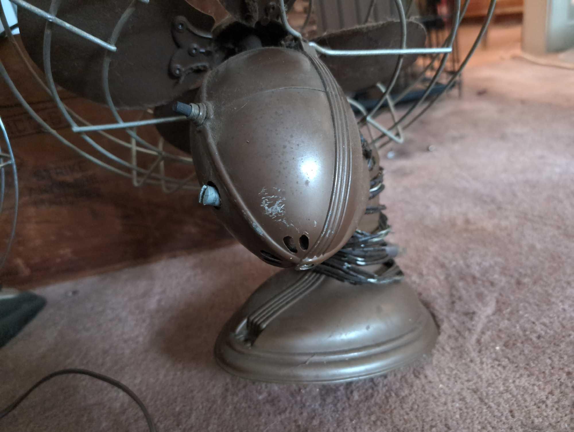 (LR) LOT TO INCLUDE: A VINTAGE ROBBINS & MYERS METAL ELECTRIC FAN, VINTAGE DOMNICK ELECTRIC METAL