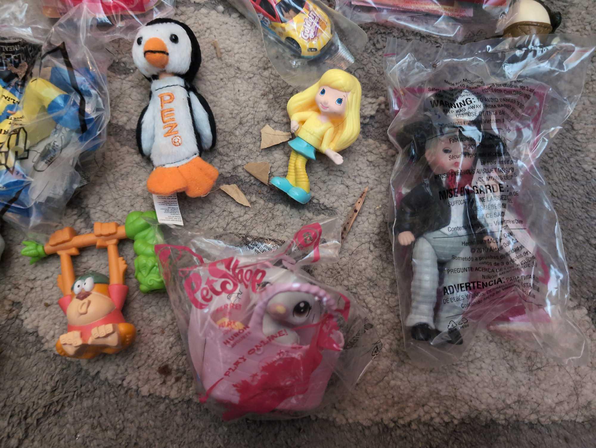 (LR) BAG LOT OF MISC. HAPPY MEAL TOYS.