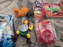 (LR) BAG LOT OF MISC. HAPPY MEAL TOYS.