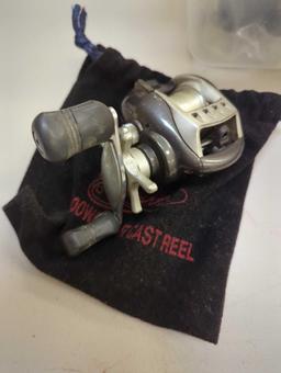 Clear tote and contents including various spinning reels. Comes as is shown in photos. Appears to be
