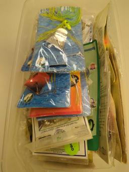 White Sterilite organizer tote filled with packaged fishing lures. Comes as is shown in photos.