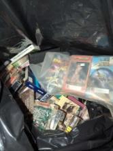 (DR) BAG LOT OF VHS MOVIES AND SHOW, MOSTLY HUNTING ORIENTED. INCLUDES BOX WITH CASSETTES