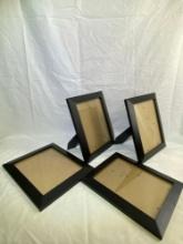 Lot of 4 Black Picture Frames. Measures 12 in x 10 in.