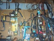 (GAR) WALL LOT OF MISCELLANEOUS ITEMS TO INCLUDE, HAMMERS, CLIPPERS. HOSE, CLAMPS, ETC