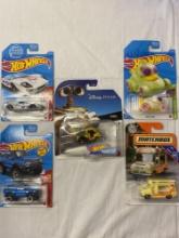 Hot Wheels WALL-E themed collectible, with 3 assorted Hot Wheels collectibles, and 1 Matchbox