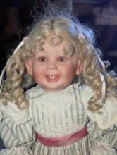 (GAR) Blonde Haired and Blue Eyed Porcelain Doll Wearing a Green and with Striped Dress,