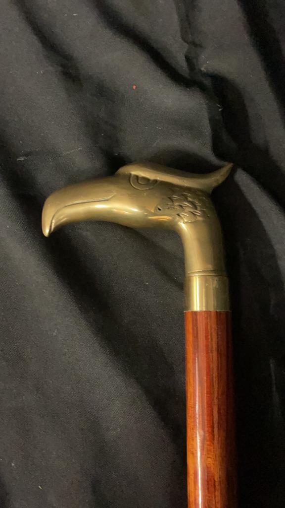 BRASS EAGLE HANDLE CANE WITH INTERIOR FLASK