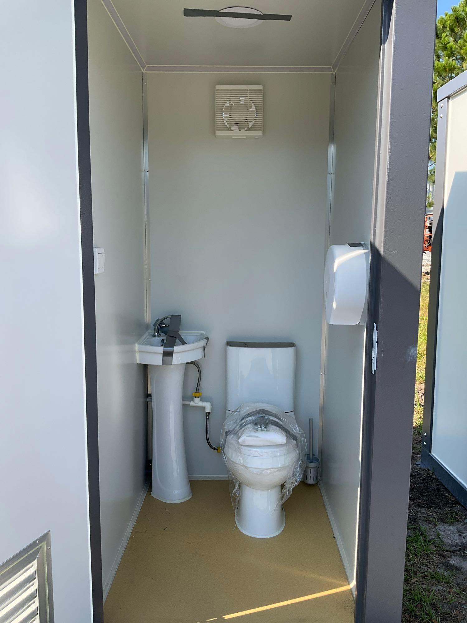 UNUSED PORTABLE DOUBLE BATHROOM UNIT, 2 STALLS, ELECTRIC & PLUMBING HOOK UP WITH EXTERIOR PLUMBING