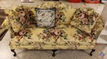 Yellow floral love seat with pillows
