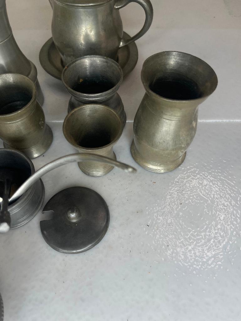 Large assortment of pewter pieces