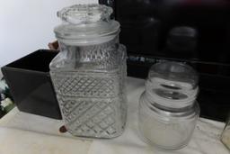 THREE CLEAR GLASS CANISTERS