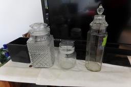 THREE CLEAR GLASS CANISTERS