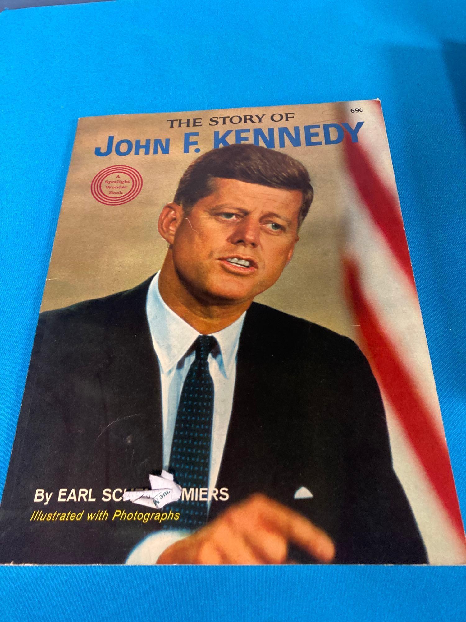 JFK book and newspapers about assassination