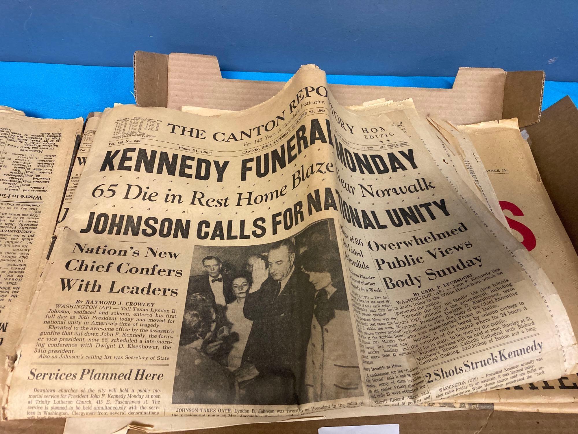 JFK book and newspapers about assassination