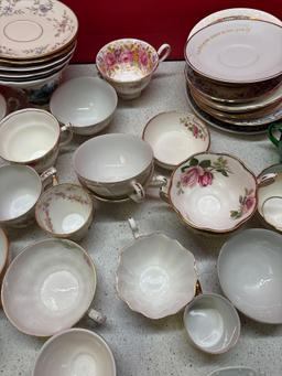 Single porcelain tea cups saucers etc.