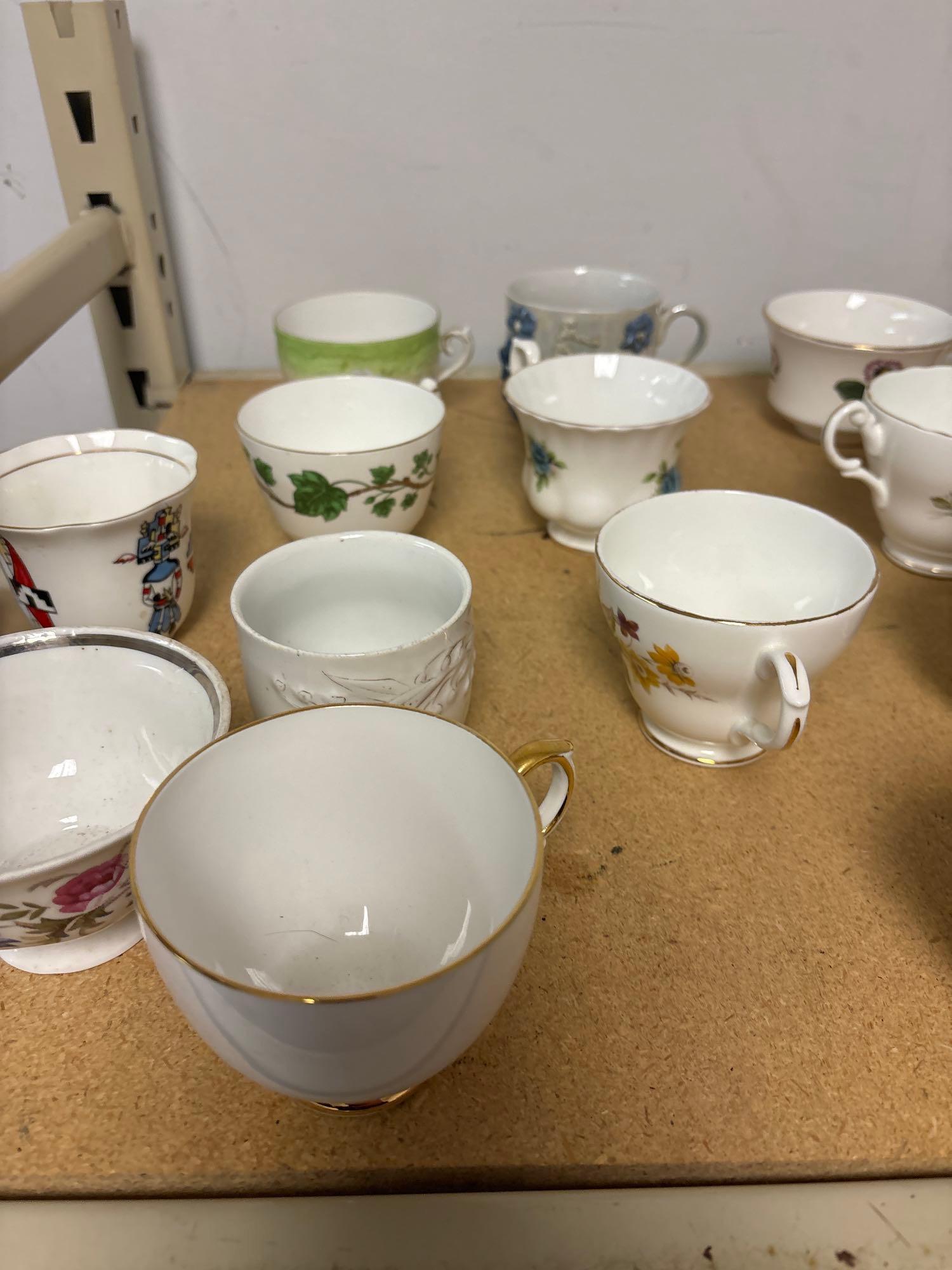 large quantity of individual tea cups saucers