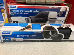 Two new RV sewer hose kits, RV water filter and five new water tight dry bags