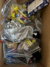 20 pounds of new items, including keychains, back scratcher, pens, bottle openers
