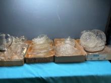 large collection of clear and cut glass