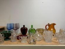 colored glass wine stems cut glass serving pieces ice bucket etc.