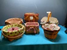 Five Longaberger baskets and one country woven basket