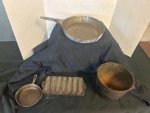 cast-iron bucket small pan and corn molds, and metal pan