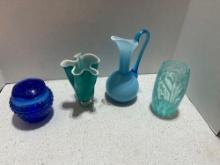 lot of blue glass. flower frog, ruffled vase, pitcher vase, and flower detailed sky blue vase
