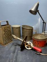 vintage tin kitchen utensils and desk lamp