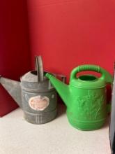 Galvanized and plastic watering cans