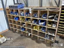 Truck parts cubby hole cabinet including assorted parts, lights, nuts, bolts, valves